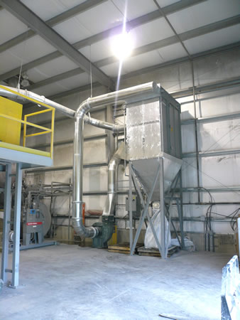 A dust collector inside of an industrial building