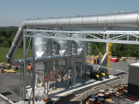 A dust collector outside of an industrial building