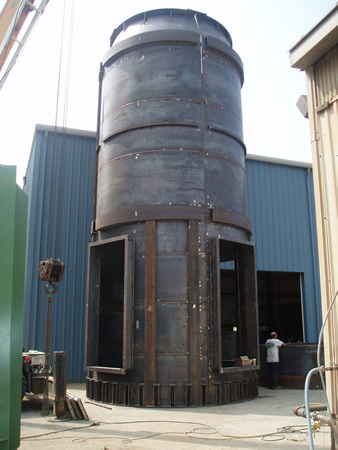 A carbon steel vent being installed on site