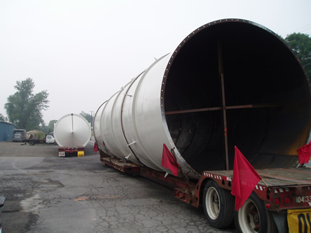 A carbon steel vent on the back of an oversized load flatbed trailer